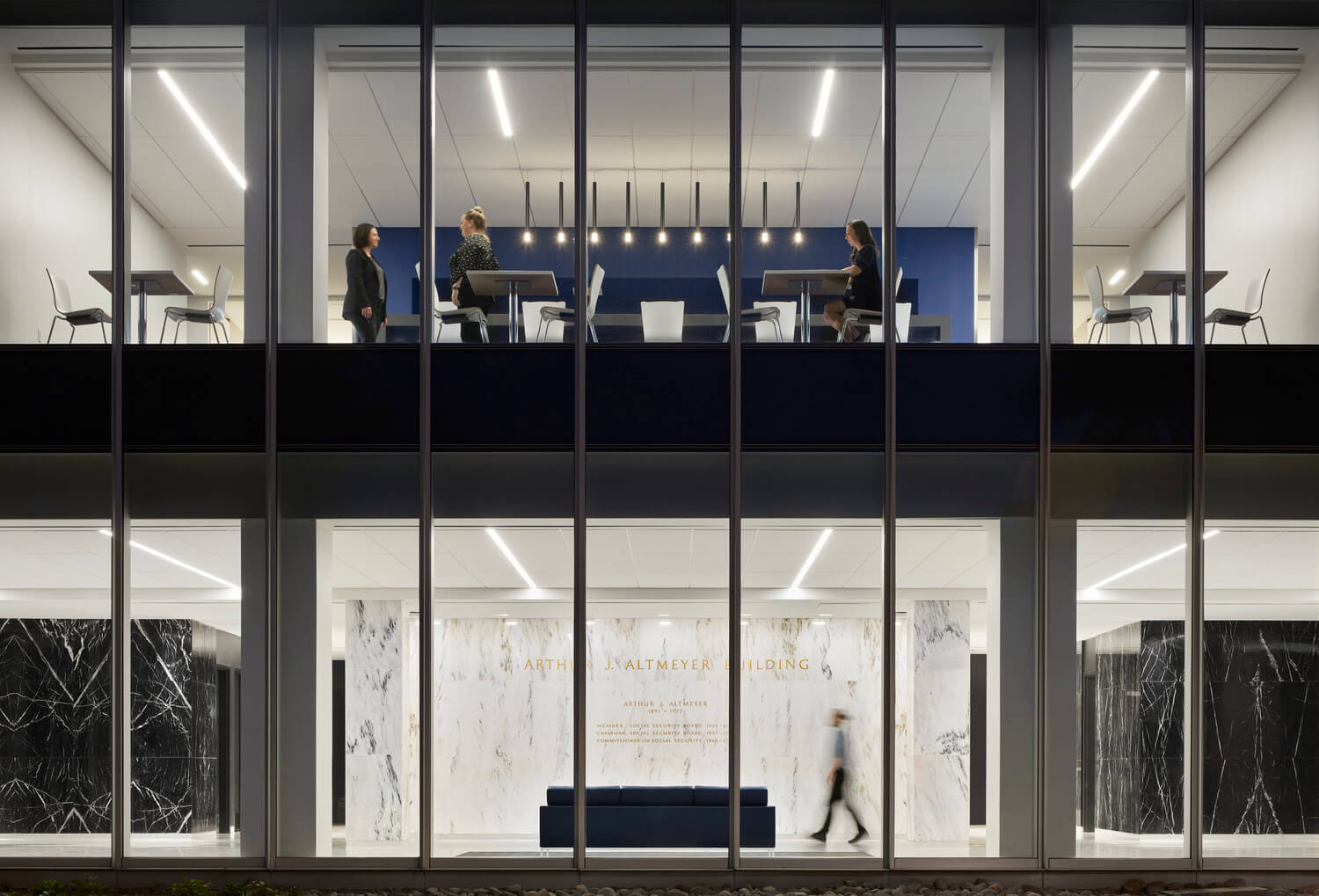 Looking through large windows into the Arthur J. Altmeyer Social Security Administration Building