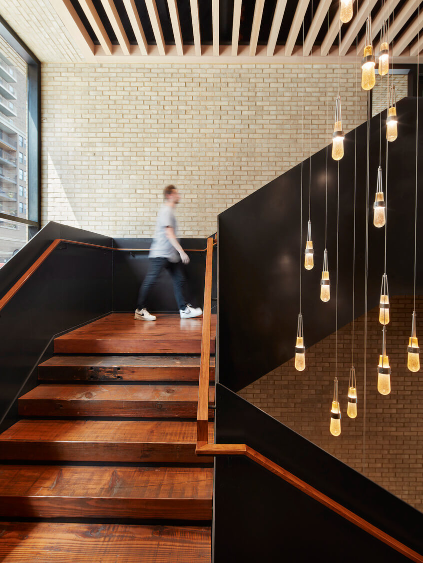 Stairs with hanging light fixtures at Water Works