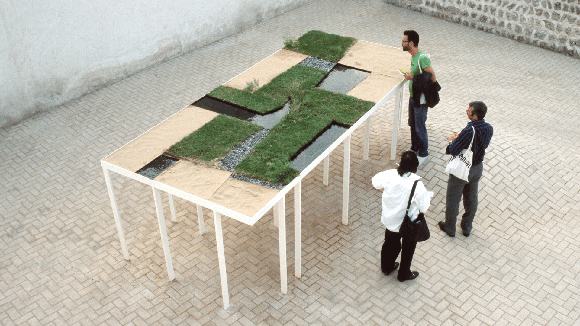 A Hanging Garden, a site-specific architectural installation by Samir Srouji at the Sharjah Biennale #8, 2007 (steel, crude oil, grass, gravel, and soil)