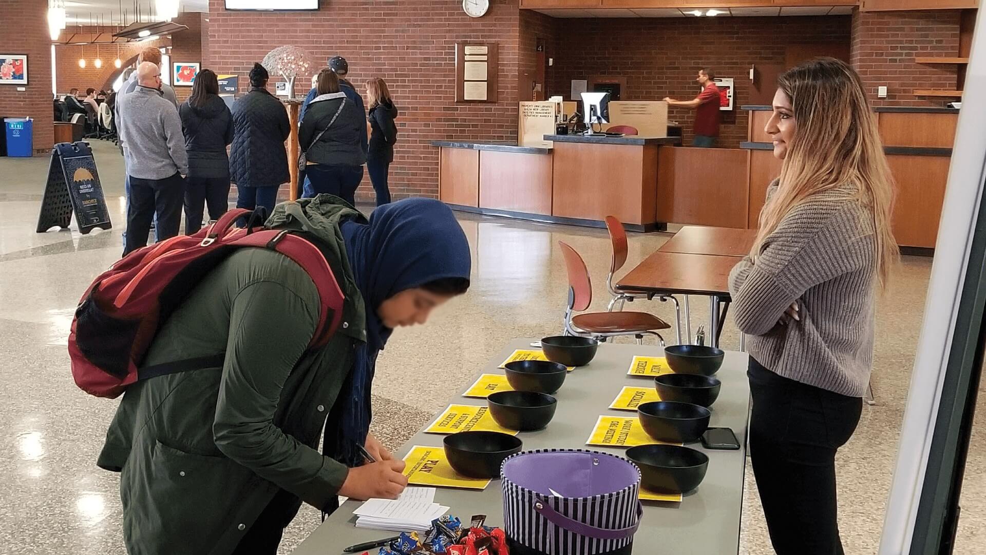 A student answers a survey in a mixed-method study for UW-Milwaukee Student Union.