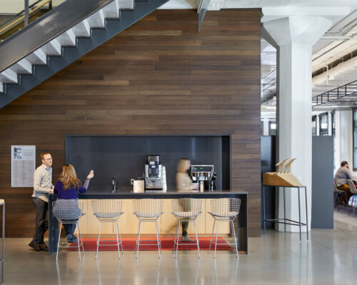 Meeting spaces, a coffee bar, and private work stations are scattered throughout HGA’s Minneapolis office.