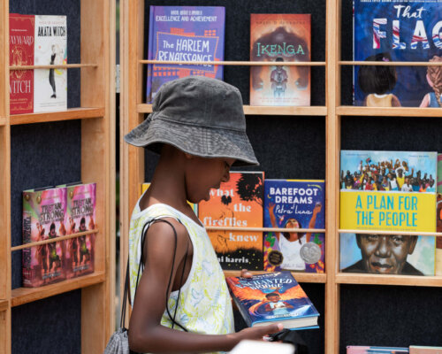 Child looking at a book in a book store