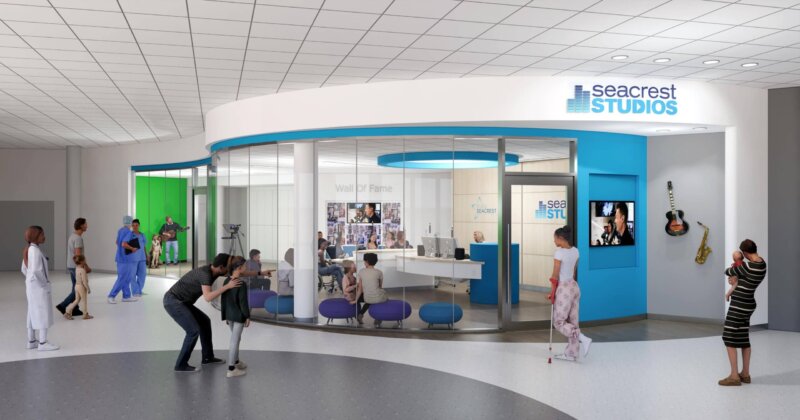 Rendering of the exterior of a lobby space with signage reading Seacrest Studios